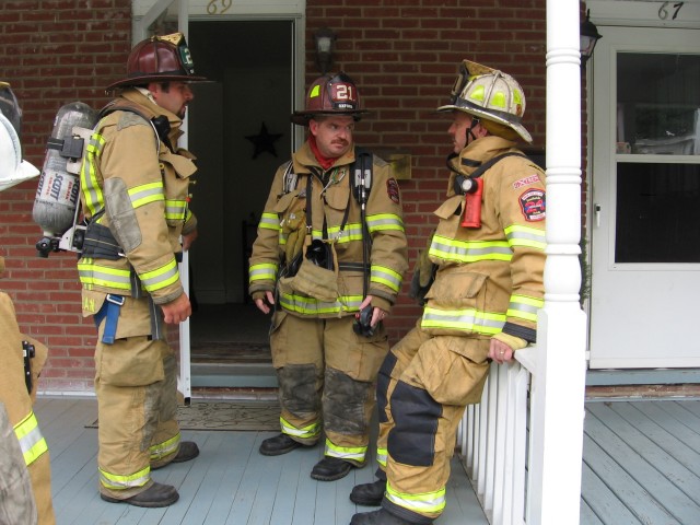 Rick Prettyman and Bob Stewart discuss their meter readings with Captain Dave McCormick.